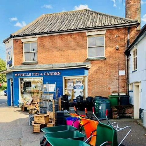 Myhills Pet and Garden shop exterior with garden supplies outside