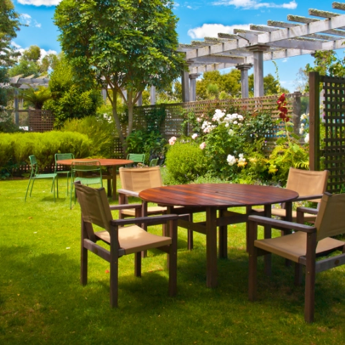 Garden furniture set with table and chairs on a lawn