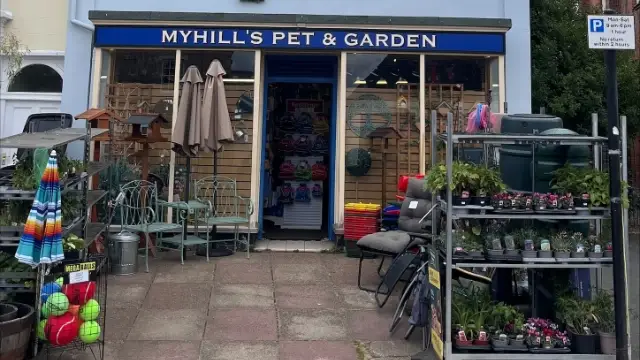 Myhills Pet & Garden shopfront in Diss with garden furniture, plants and pet products displayed outside.
